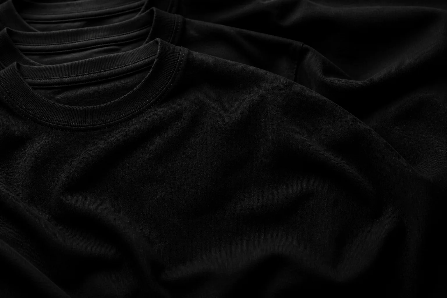 Stacked heavyweight black cotton shirts